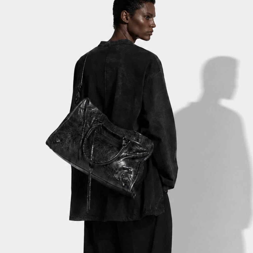 Balenciaga black leather City Bag styled with contemporary black fashion – shop Balenciaga bags at ELLIS ROSCH