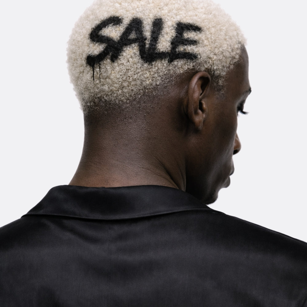 Bold luxury fashion sale imagery featuring a contemporary aesthetic, expressing confidence, individuality, and a modern approach to designer style.