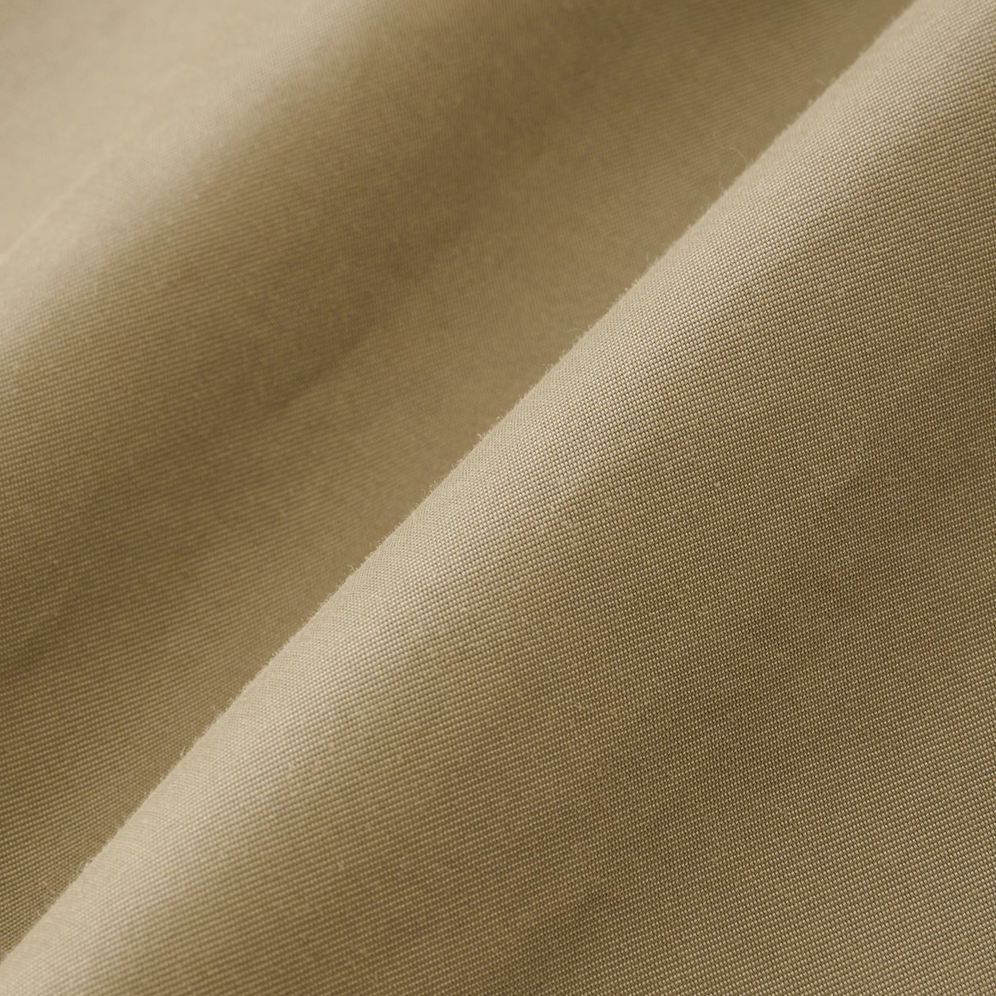 The Holin Coated Cotton Coat from Studio Nicholson