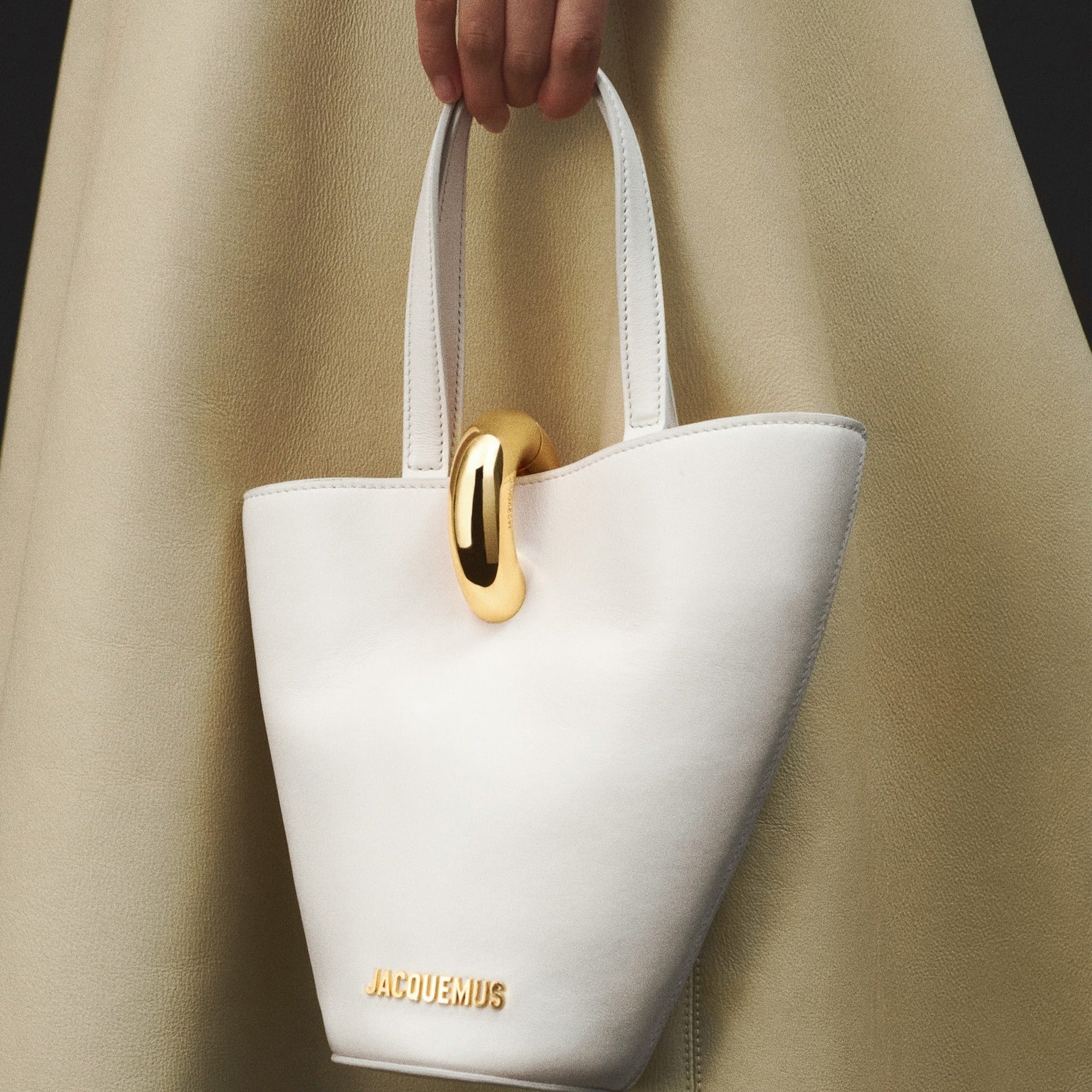 The Small Bambola Asymmetric Mini Bucket Bag from Jacquemus