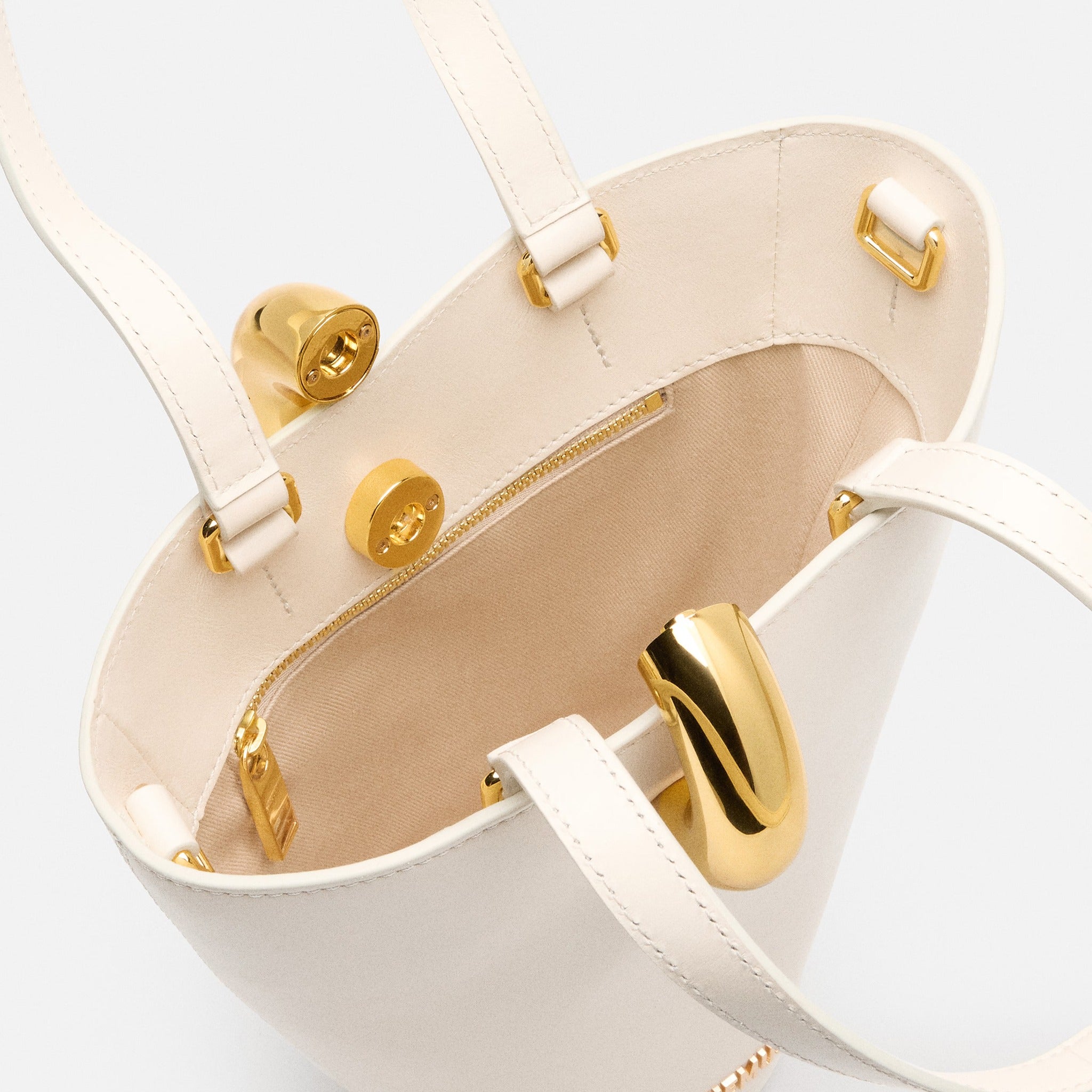 The Small Bambola Asymmetric Mini Bucket Bag from Jacquemus