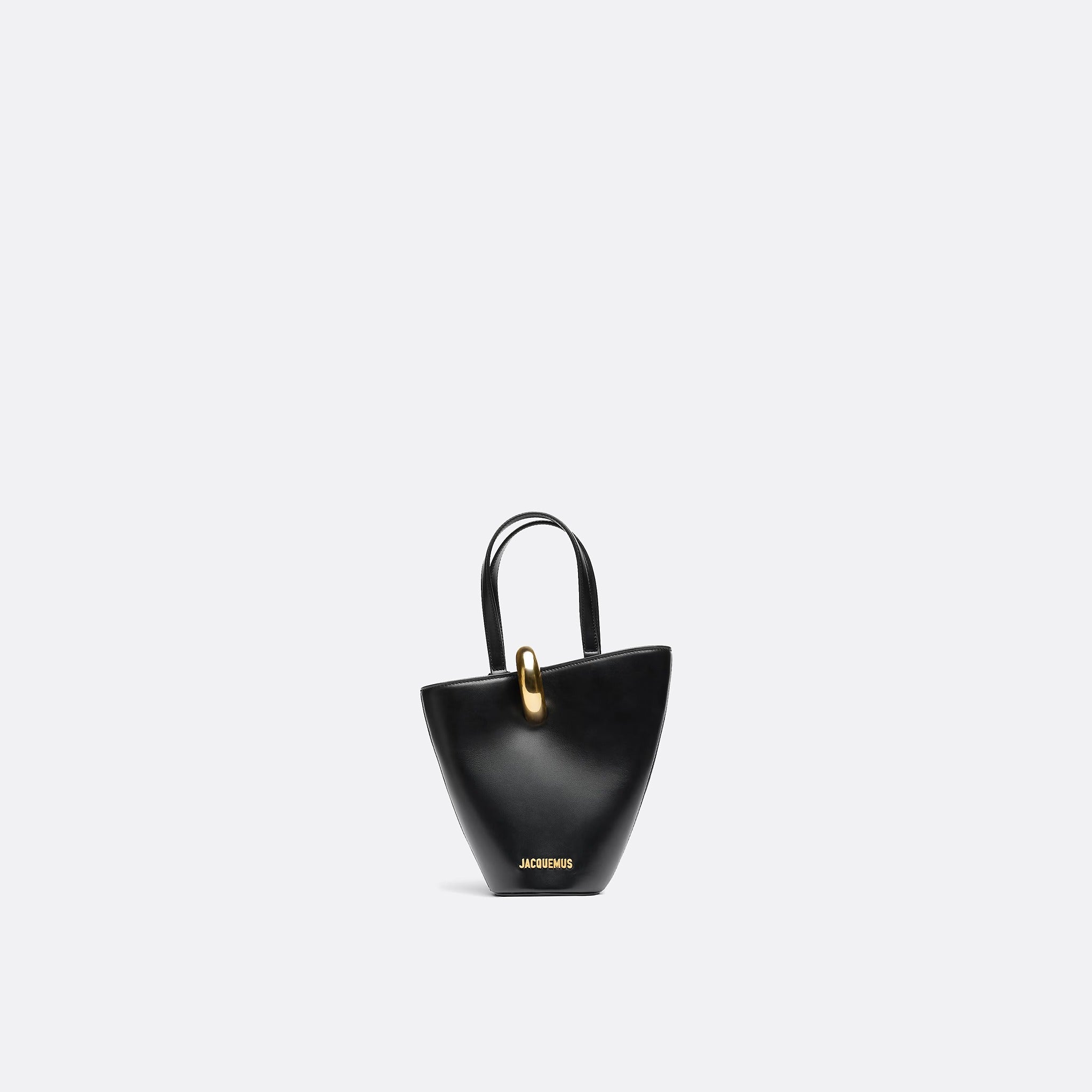The Small Bambola Asymmetric Mini Bucket Bag from Jacquemus in Black