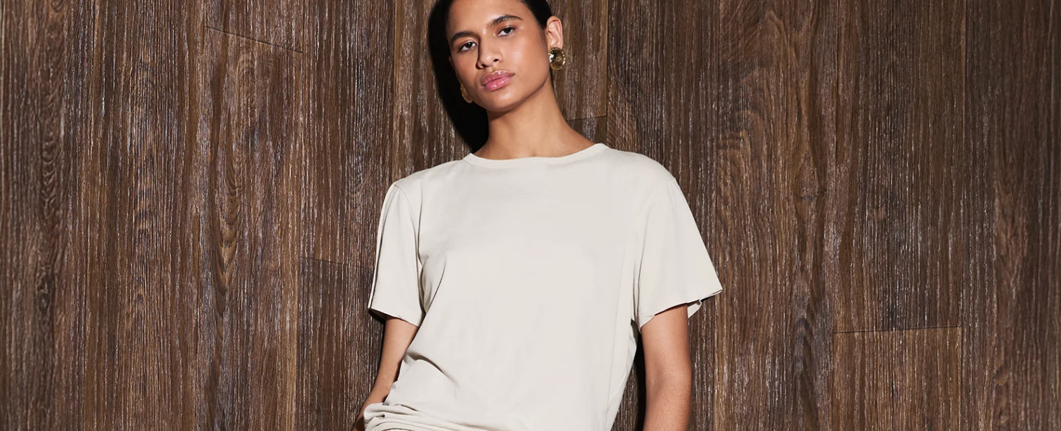 Entire Studio Model wearing a beige t-shirt