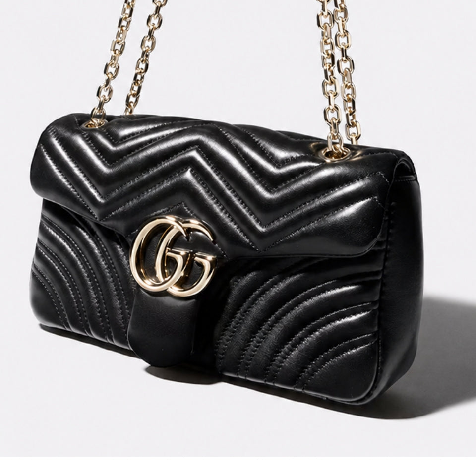 Gucci GG Marmont black leather shoulder bag with gold hardware – shop luxury bags at ELLIS ROSCH