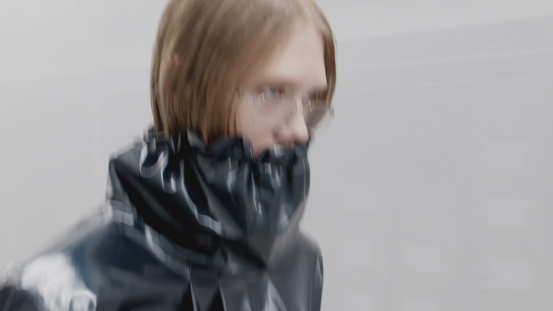 RAINS runway show presenting waterproof outerwear, minimalist bags, and Scandinavian rainwear — urban functionality elevated with contemporary fashion design.