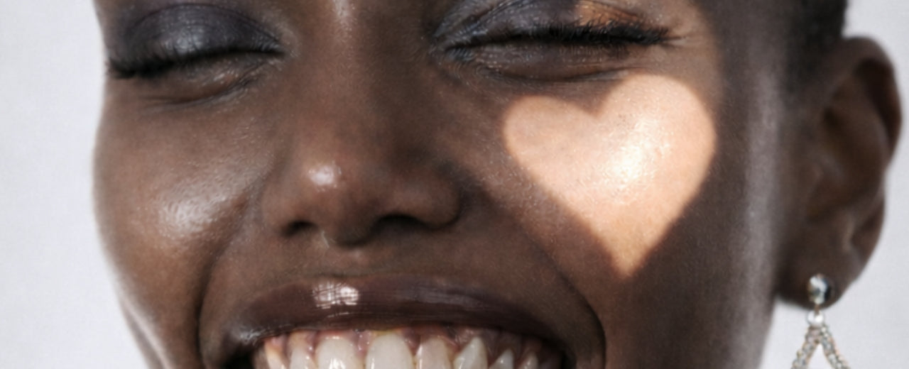 Tight portrait of a joyful expression illuminated by gentle heart-shaped light, evoking luxury, emotional connection, and a thoughtful gift for someone special.