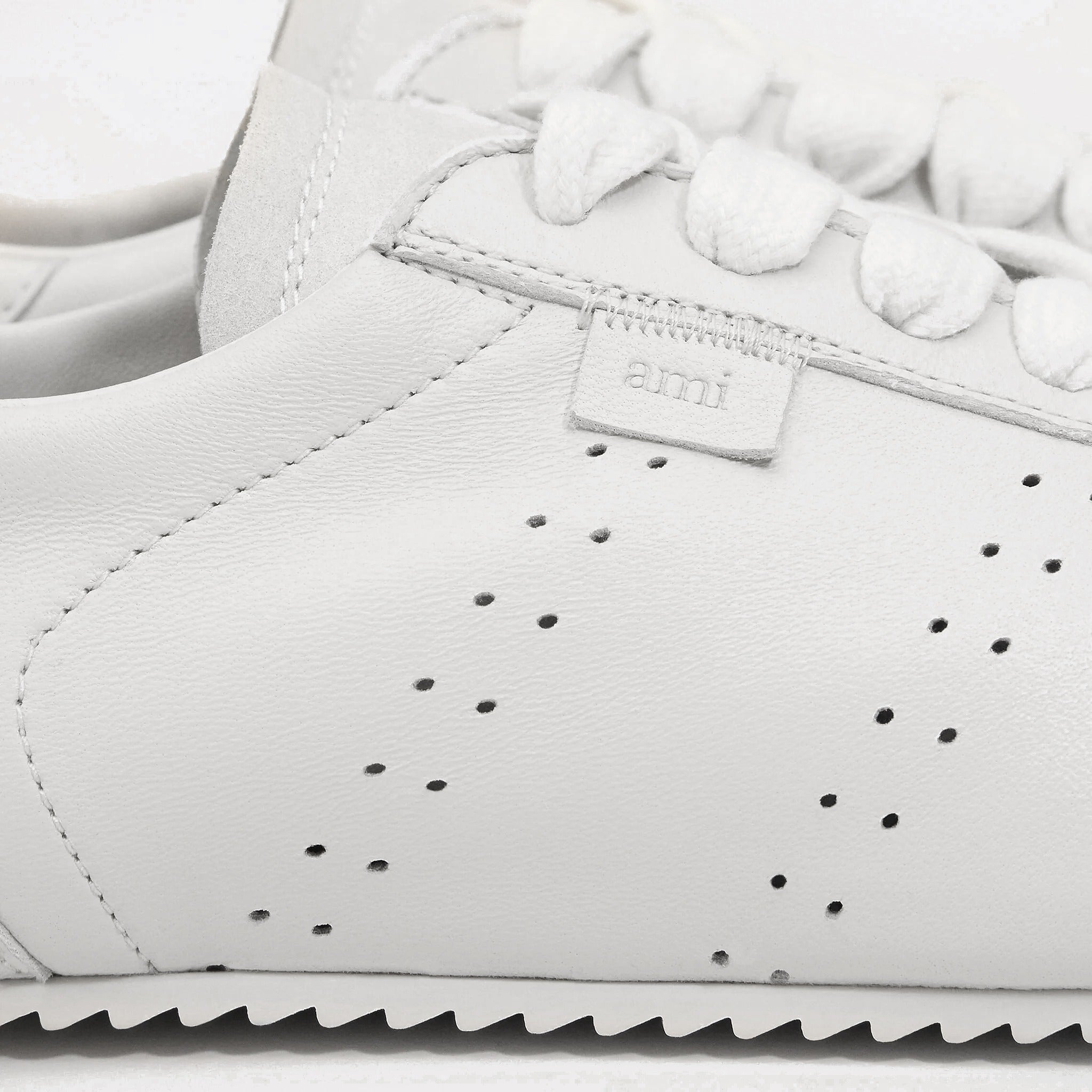 The Low Top Step Sneakers from AMI Paris in White