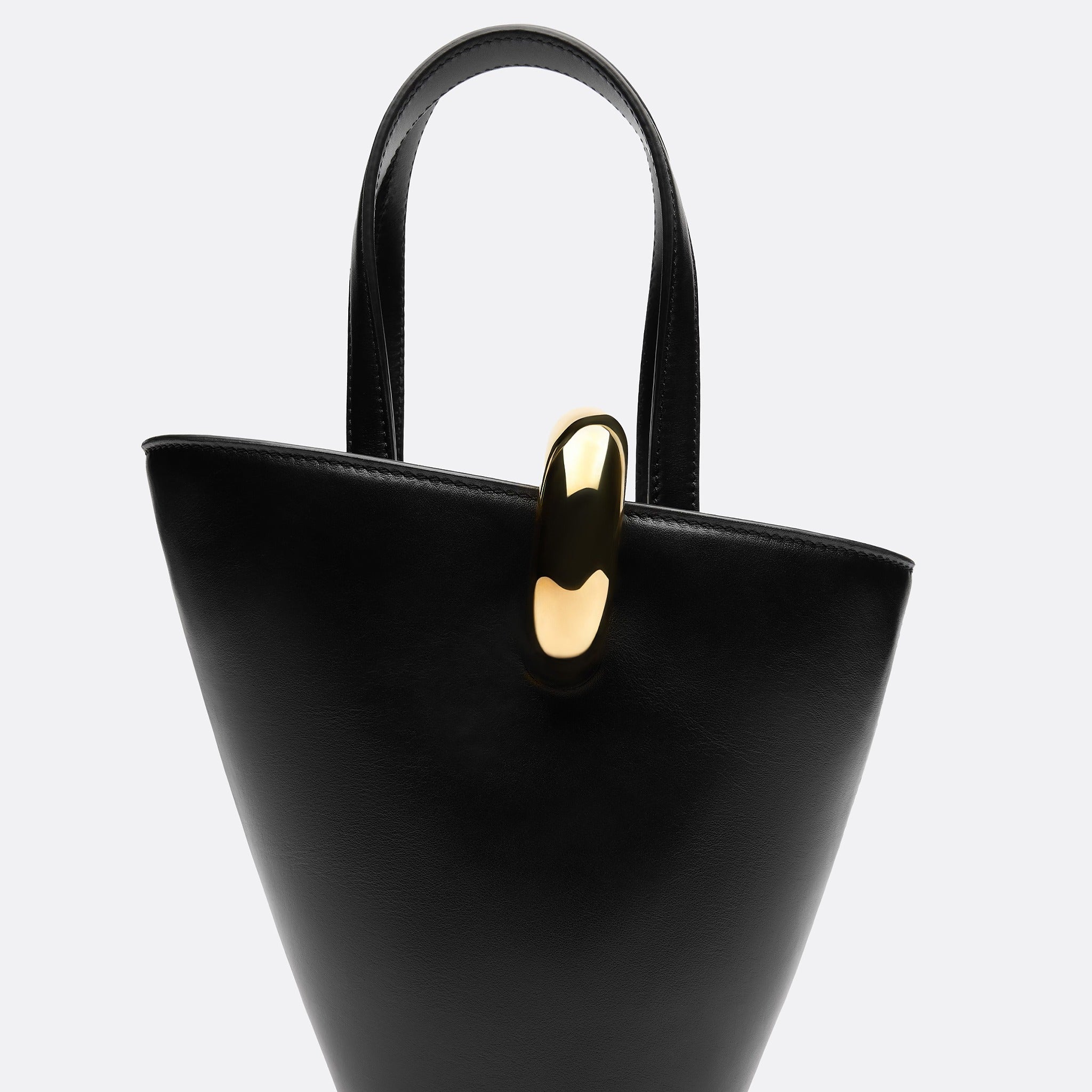 The Small Bambola Asymmetric Mini Bucket Bag from Jacquemus in Black