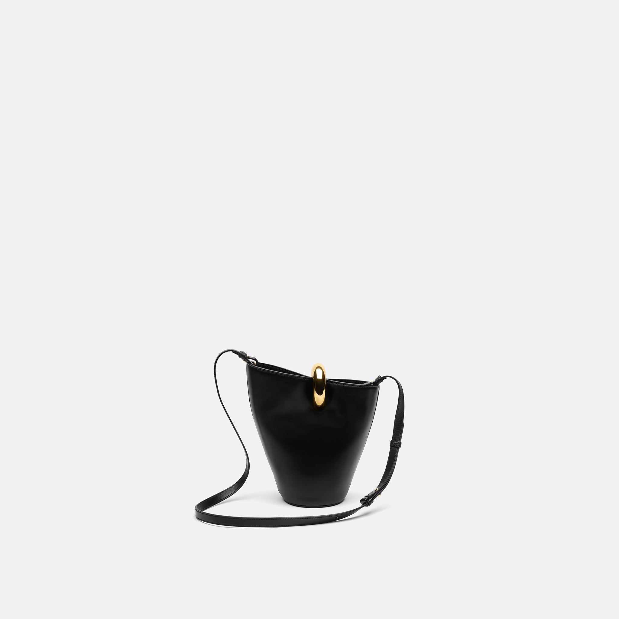 The Small Bambola Asymmetric Mini Bucket Bag from Jacquemus in Black