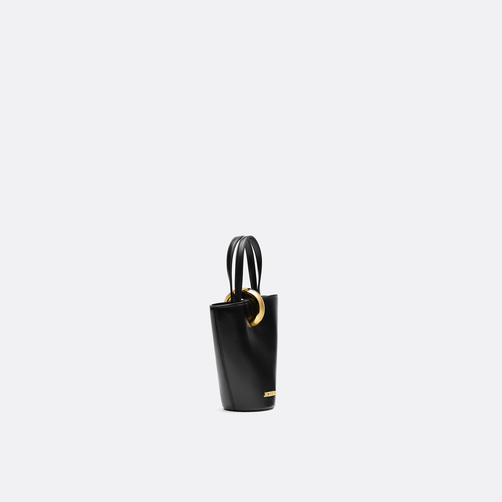 The Small Bambola Asymmetric Mini Bucket Bag from Jacquemus in Black