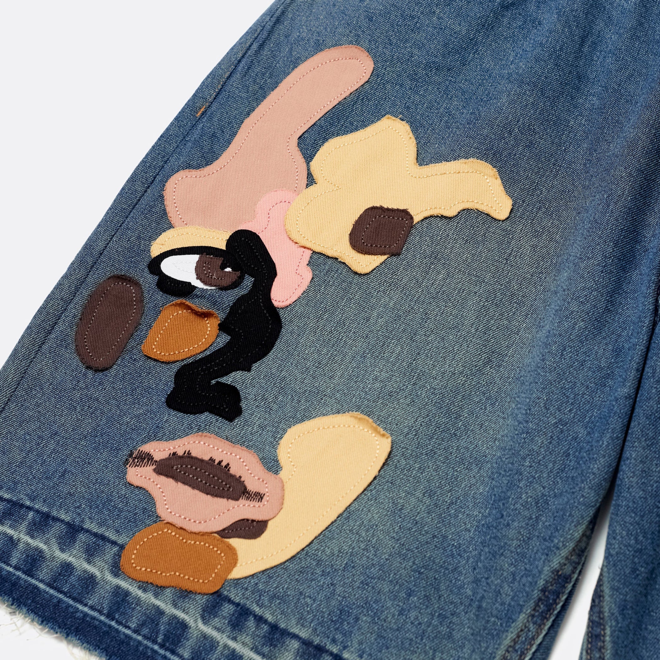 ELLIS ROSCH KidSuper Face Patchwork Baggy Shorts