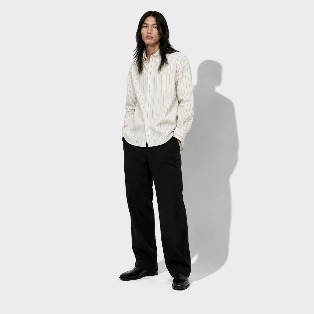 Striped shirt styled with black wide-leg trousers – shop designer men’s ready-to-wear and clothing at ELLIS ROSCH